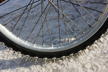 Close-up of a motorcycle studded tire tread for speedway racing