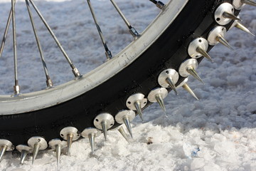 Close-up of a motorcycle studded tire tread for speedway racing