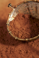 cocoa powder in old rustic style silver sieve