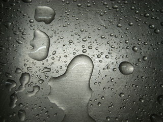 Water drops on a metal surface.