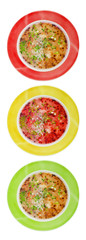 Fototapeta na wymiar Multi-colored plates with vegetable soup