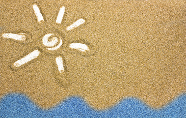 Sun shaped drawn in sand