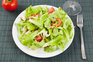 fresh salad with chicken and tomatoes