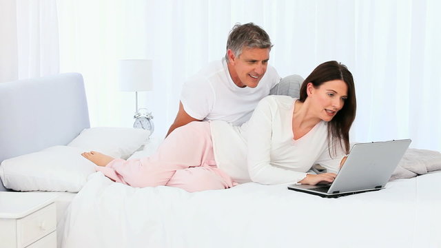 Middle aged couple using a laptop