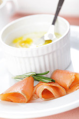 Breakfast with baked eggs and salmon