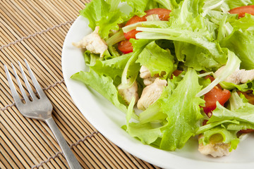 fresh salad with chicken and tomatoes