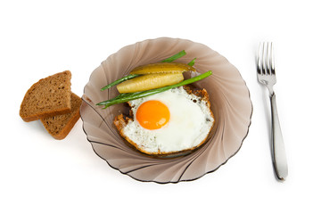 Breakfast fried eggs on a glass plate