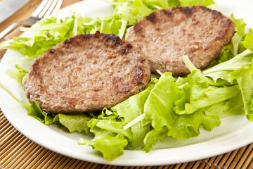 two hamburger on green lettuce