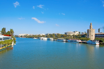 A view of the Guadalquivir River and the Torre del Oro, in Sevil