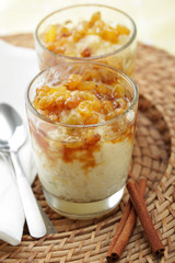 Rice pudding with raisins and cinnamon syrup
