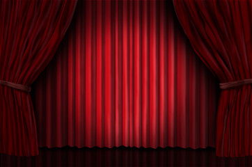 theater stage with spot light on red velvet curtain drapes