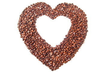 Heart from brown coffee beans on white background