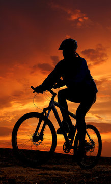 mountain biker silhouette in sunrise