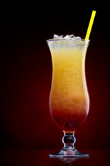 Tequila sunrise Cocktail isolated on a Red