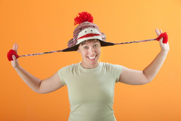 Woman Pulling Her Hat