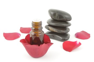 essential oil and rose petals