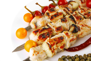 roast pork shish kebab on white