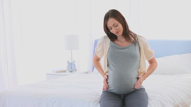 Pregnant woman having a back pain