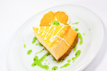a slice of orange cheesecake
