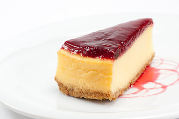 a slice of raspberry cheesecake