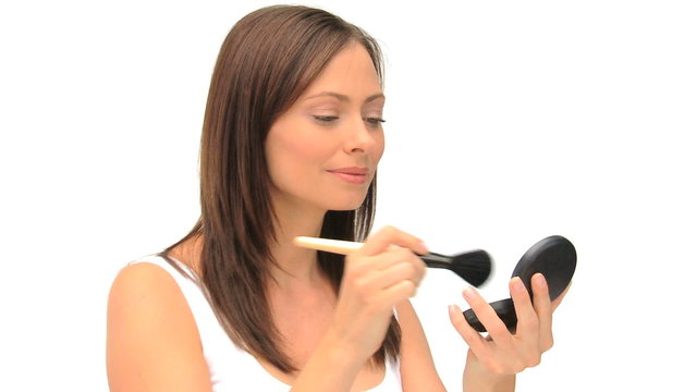 Coquette woman putting on make-up