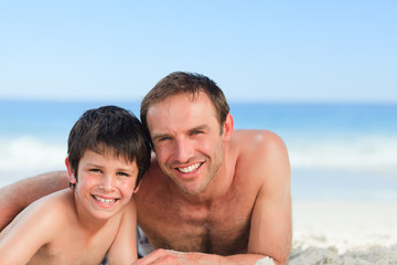Fototapeta premium Father with his son on the beach