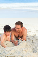 Fototapeta premium Father with his son on the beach