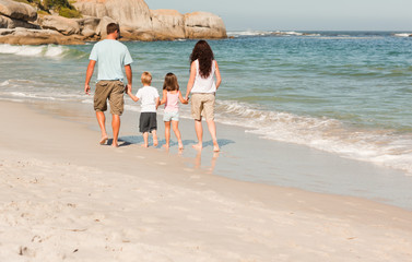 Family walking on the beach