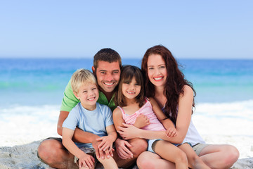Fototapeta na wymiar Portrait of a family at the beach
