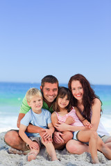 Fototapeta na wymiar Portrait of a family at the beach