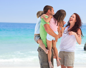 Happy children playing with their parents