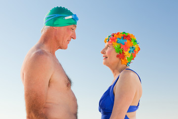 Enamored elderly couple at the beach