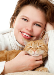 Young girl with a red cat