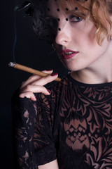 Obraz premium Beautiful smoking woman. Retro portrait