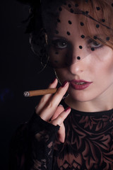 Obraz premium Beautiful smoking woman. Retro portrait