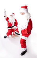 Two santa claus on white background with sledge