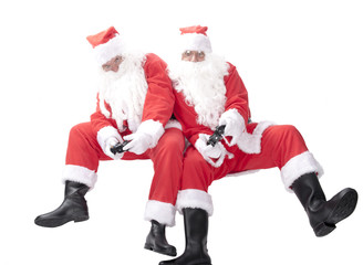 Two santa claus on white background playing games