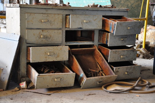 opened and empty drawers of an old furniture