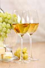 Still-life with bunch of grapes and white wine