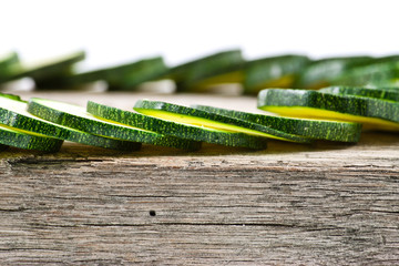 courgette cut to slices on breadboard