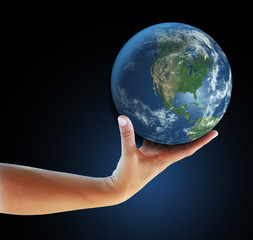 Hand holding realistic globe symbolizing environmental care