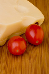 Cheese slice and red tomato