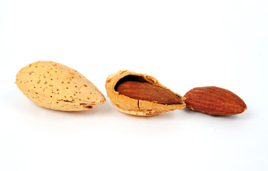 Three almond isolated on white background