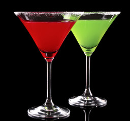 Martini glasses on black background