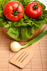Different ripe vegetables compositions in studio on bamboo