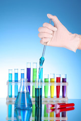 Test tubes over blue background