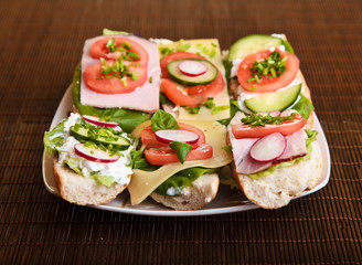 Different sandwiches with vegetables and cheese isolated