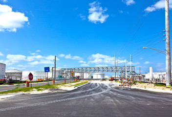 entrance of refinery with tanks