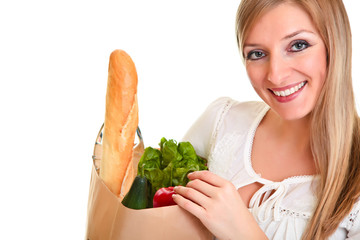 Woman carrying bag of groceries isolated on white