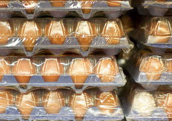 Eggs in big packages in supermarket